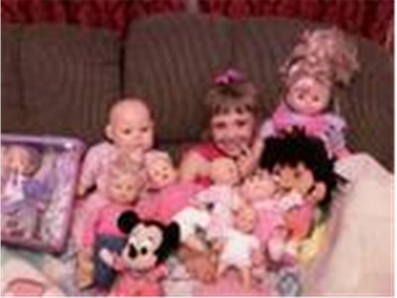 Most Baby Dolls Sitting With A Five-Year-Old Girl